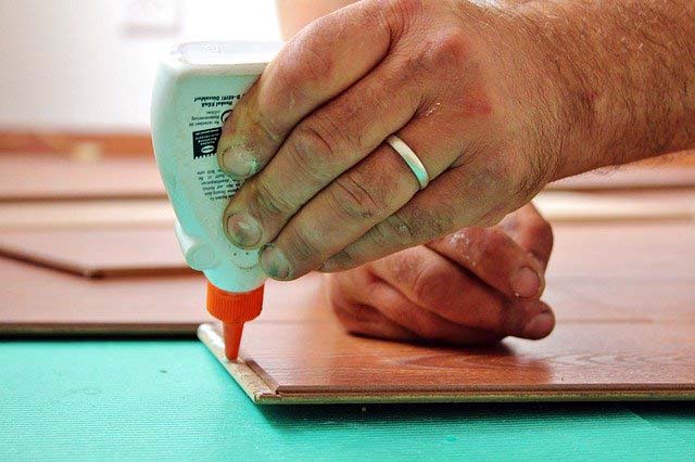 Photo of a man working on a DIY flooring project