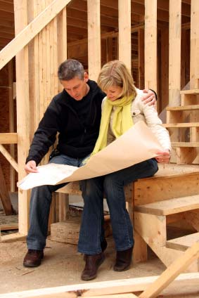 Photo of a couple at a new construction home site